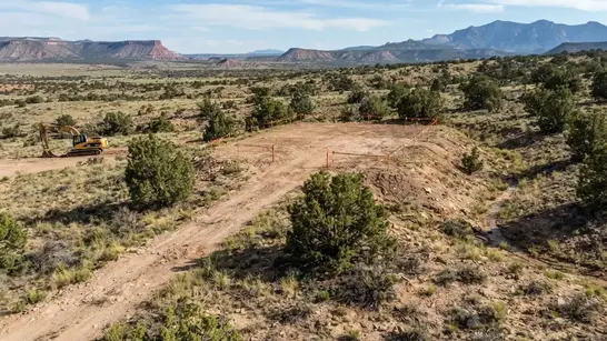 Rural Apache County Arizona homesite location selected in relation to terrain drainage and driveway access