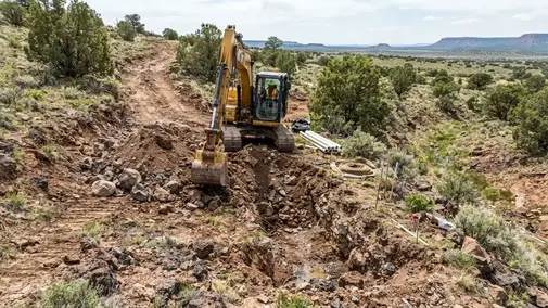 Rocky sloped rural property in Apache County Arizona being prepared for septic installation