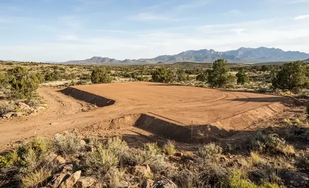 Completed graded house pad ready for construction on rural land in Apache County Arizona