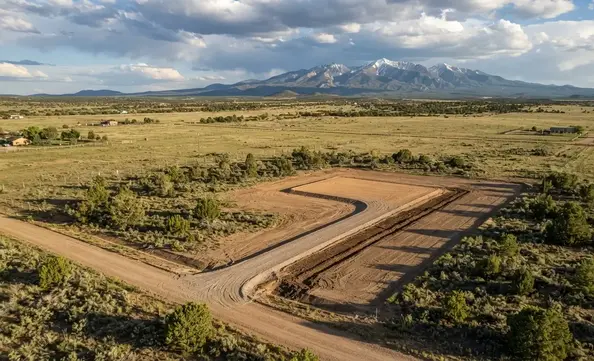 New gravel access road leading to an off-grid homesite in Apache County Arizona